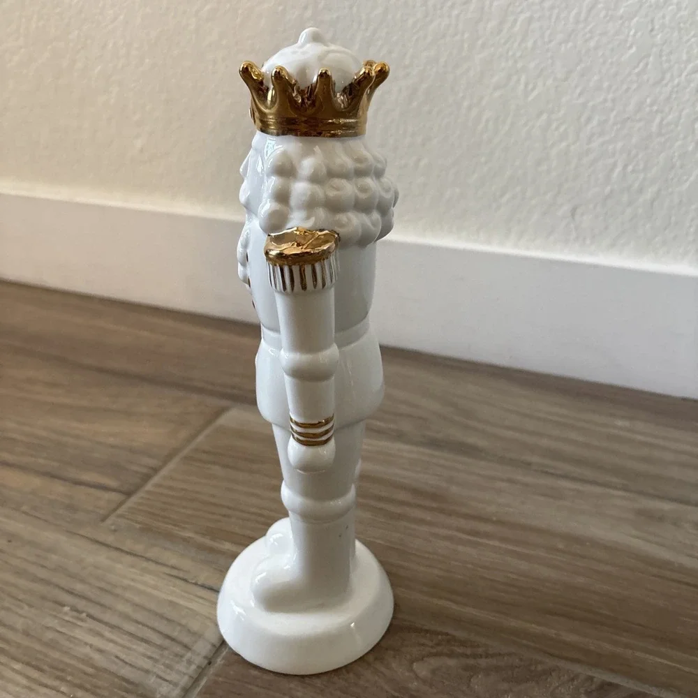White Porcelain Nutcracker with Gold Trim Form The Holiday Aisle Figurine
